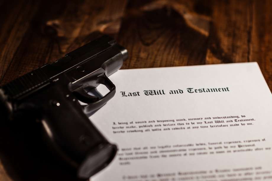 A handgun rests on a wooden table next to a document titled "Last Will and Testament," hinting at the serious consequences of estate planning mistakes NYC residents should avoid.