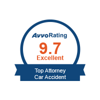 Circular badge showing "Avvo Rating 9.7 Excellent" with a ribbon saying "Top Attorney Car Accident" on a white background—perfect for showcasing credibility on your Homepage V6.