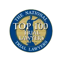 Circular badge featured on the Homepage V6, displaying "The National Trial Lawyers Top 100 Trial Lawyers" around an image of Lady Justice holding scales.