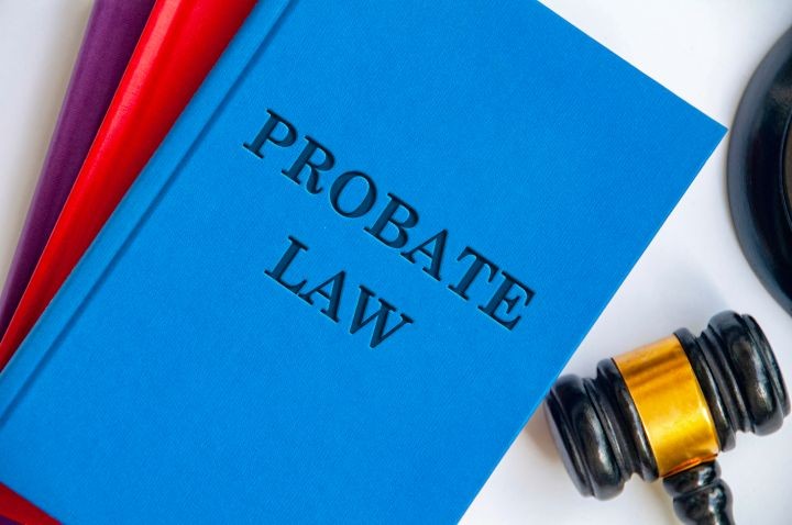 Blue Probate Law book with a black and gold judge gavel.