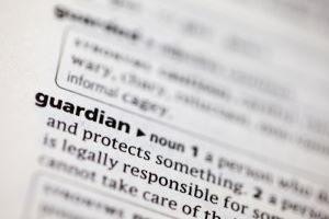 Close-up of a dictionary entry for the word guardian with legal definitions.